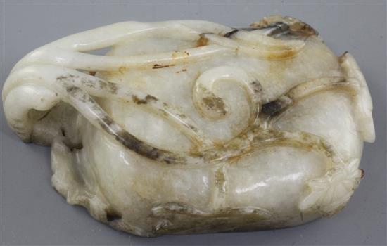 A Chinese white and grey jade brushwasher, 16th / 17th century, length 11.3cm